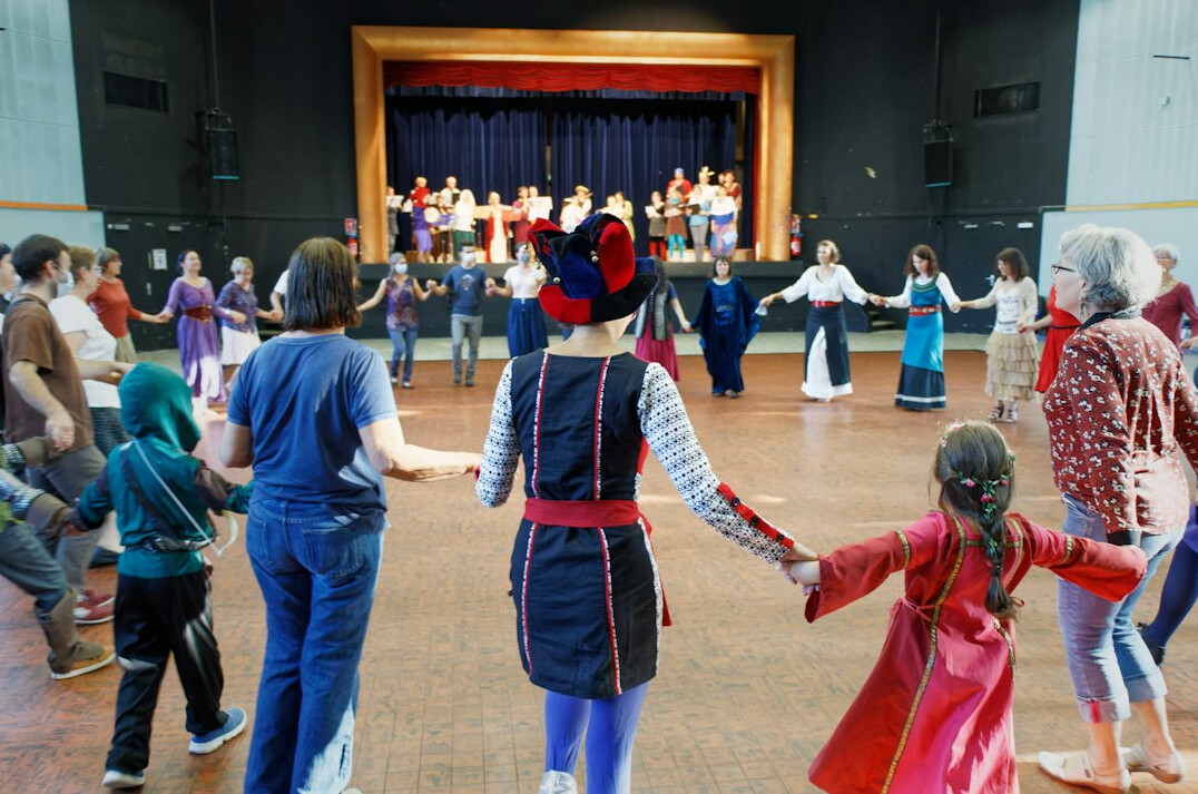 Group of participants in a circle during a workshop exercise